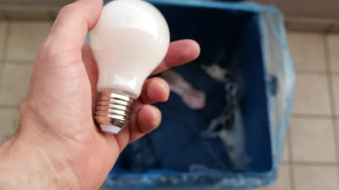 A Man’s Hand Throws Light Bulb Into A Mixed Waste Bin. 4K Stock Footage 253186000