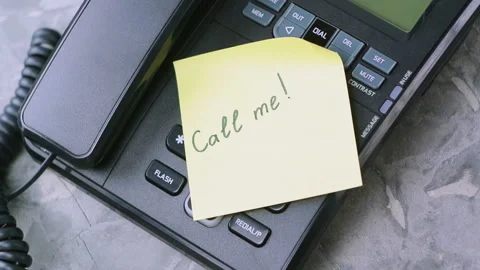 Man's hand throws paper sheet with handwritten inscription call me Stock Footage 91693968