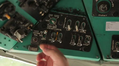Man's hand toggle switch helicopter dashboard. Closeup. Stock Footage 63830990