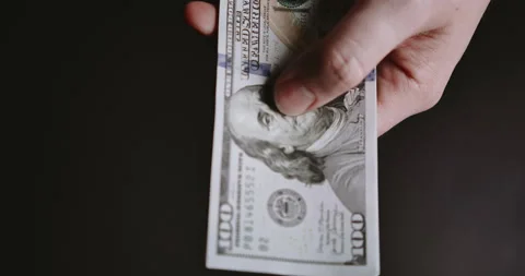 Man's hand touches dollars Stock Footage 205040822
