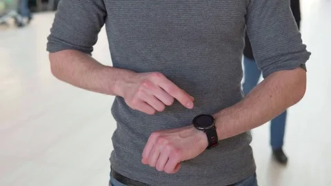 Man's hand touches the screen smart watch Stock Footage 80793460