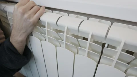 Mans Hand Touching and Checking White Central Heating Radiator Stock Footage 328659717