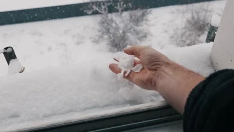 Mans Hand Touching and Squeezing Fresh Snow on a Cold Winter Day Stock Footage 327954274
