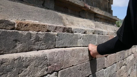 A man's hand touching the temple building Stock-Footage 291372116
