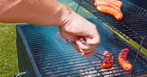 A man's hand translates one slice of meat and the other cannot be grasped from Stock Footage 252830956