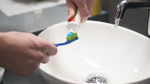 A man's hand. A tube of toothpaste. Stock Footage 150974909