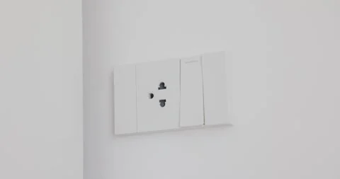 Man's hand Turn on, turn off light switch in office. white one electrical o.. Stock Footage 260316758