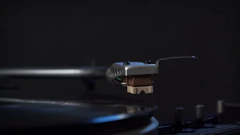 Man's hand turning a vintage record player on Stock Footage 132000291