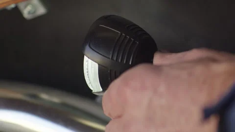 A man's hand turns off the external car light Stock Footage 265084727
