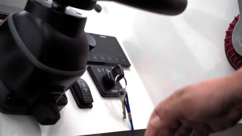 The man's hand turns the ignition key of a high-speed motor boat or yacht. July Stock Footage 143594067