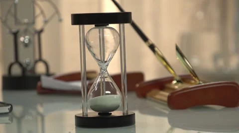 Mans hand turns the sand clock to ON Stock Footage 60814864