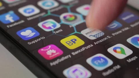 Man's hand types on the Amazon app on a smartphone Stock Footage 126406767