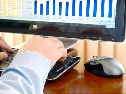 Man's Hand Typing at a Computer Keyboard Stock Photos