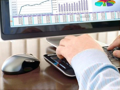 Man's Hand Typing at a Computer Keyboard Stock Photos