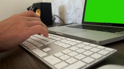 A man's hand typing on a keyboard pc Green screen Stock Footage 57490775