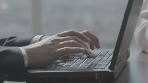 Man's Hand Typing on Laptop Computer in Slo Mo Stock Footage
