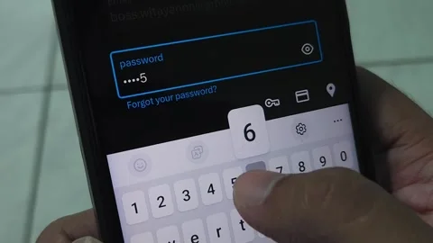 Man's hand typing password  on smartphone Stock Footage 296103451