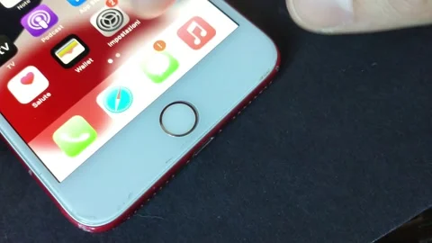 Man's hand unlock iphone screen with the touch ID. iphone home swipe. Stock Footage 234872738