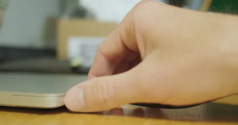 Man's hand unplugs Type C cable from laptop. Disconnect charging, data transfer Stock Footage 198325955