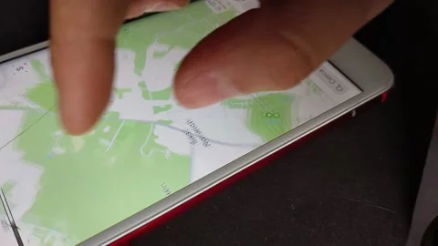 Man's hand use gps maps app on the iphone display. iphone gps. Video stock 238781222