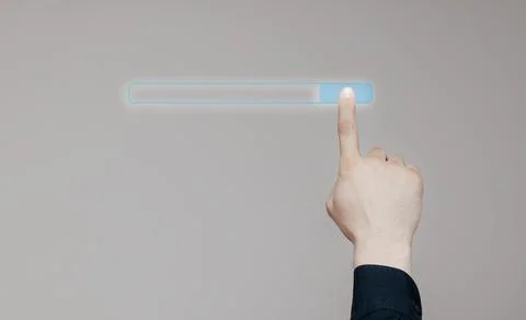 Man's hand uses a browser on the touch screen of the computer. Hand uses the bar Stock Photos