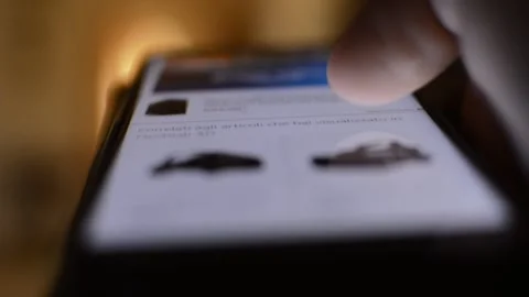 Man's hand using amazon shopping marketplace on the telephone. amazon shopping. 스톡 동영상 219466193