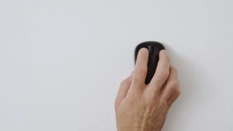 Man's hand using computer mouse wireless. Clicking and moving Video stock 136938047