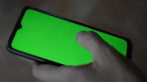 Man's hand using iphone with green screen Stock Footage 200821380