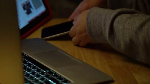 A man's hand using a laptop and a smartphone 動画素材 83425839
