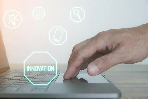 Man's hand using a laptop computer. Stock Photos