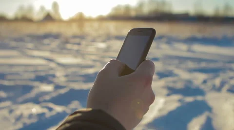 Man's Hand Using Smart Phone in Winter Closeup Stock Footage 62287941