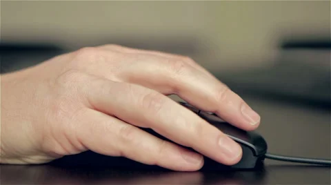 Man's hand using a wired computer mouse Stock Footage 35306016