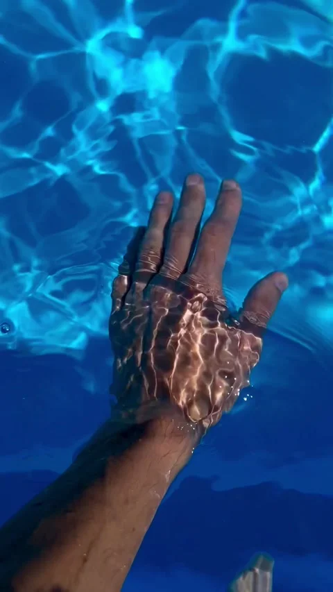 Man's hand in the water in the pool Stock Footage 248531067