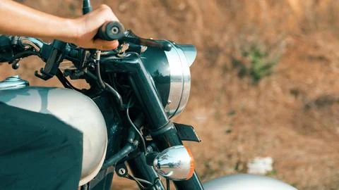 Man's hand while riding a motorcycle side view Stock Photos