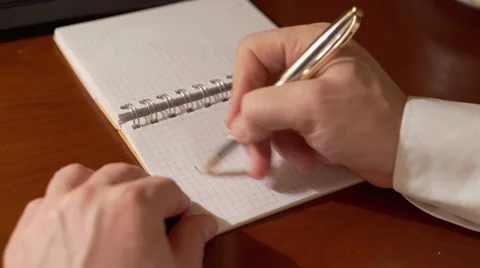 Man's hand wiriting word MAN on the paper  Stock Footage 62086795
