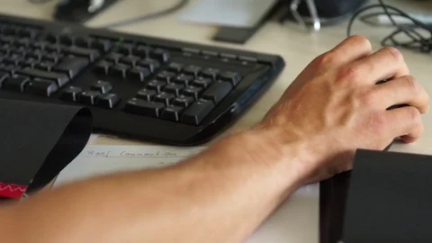 Man's hand working on computer in office Stock Footage 77811467