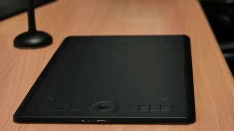Man's hand working on graphics tablet Stock-Footage 85402440