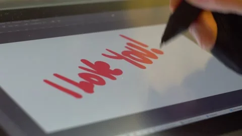 Man's hand writes a confession on a graphics tablet 4K Video stock 170065695