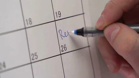 Man's hand writes the date of visit mom on the calendar. an important event. don Stock Footage 153526762