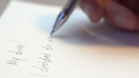 Man's hand writes a letter on a sheet of paper 4K Stock Footage 170061128