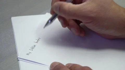 Man's hand writes on paper 4K Stock-Footage 170061046