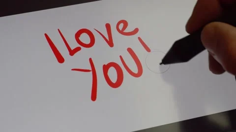 Man's hand writes a red love inscription 4K Stock Footage 170065745