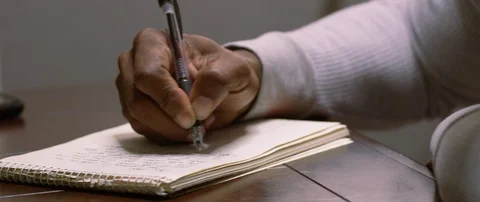 Mans hand writing a letter at the table Video stock 103411892