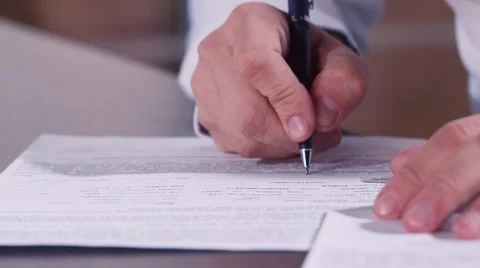 Man's hand writing text in documents Stock Footage 56285618