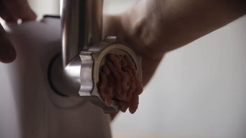 Man's hands and meat grinder Stock Footage 122585609