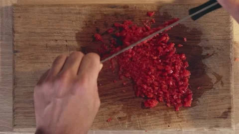 Man's hands are cutting the bell pepper with a knife, top view. Stock Footage 161942962