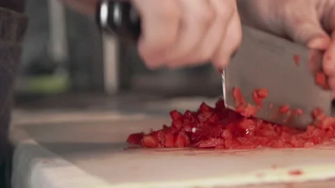 Man's hands are cutting the bell pepper with a knife, close up. Stock Footage 161942964