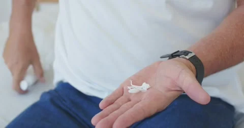 Man's hands are pressing pump, dispensing cream and rubbing lotion to moisturize Stock Footage 344340917