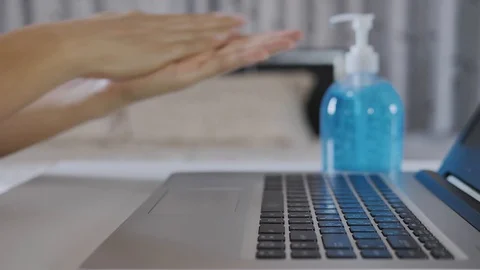 A man's hands are typing on a computer in the bedroom. Stock Footage 129597175