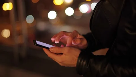 Man's hands are typing a message on the phone Stock Footage 143877407